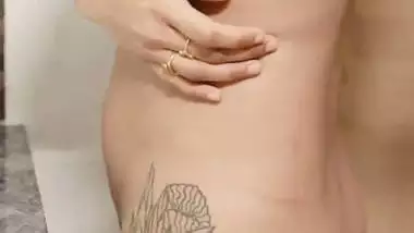 Kerala desi nude model stares at her naked body in a mirror